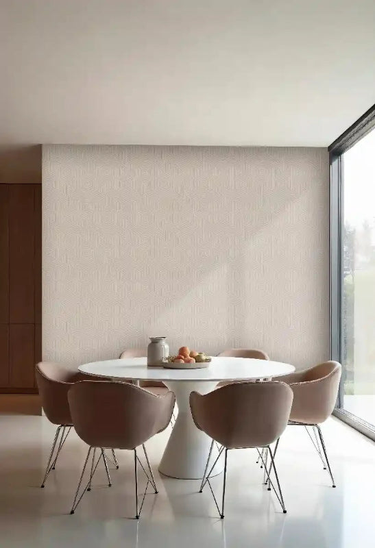 Modern dining area with white geometric wall panels and round table with neutral chairs