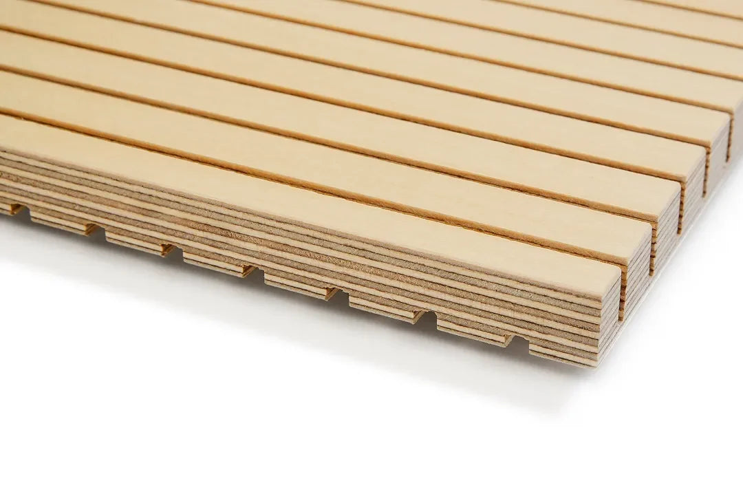 Close-up of a birch sound dampening panel sample on a white background