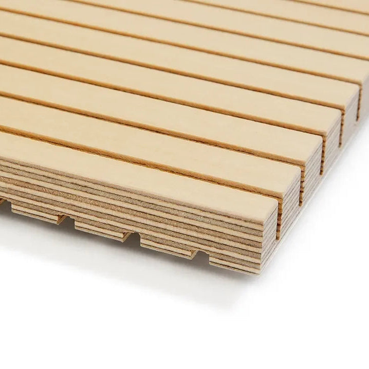 Grooved plywood sound dampening panel with layered wood edges for acoustic wall applications