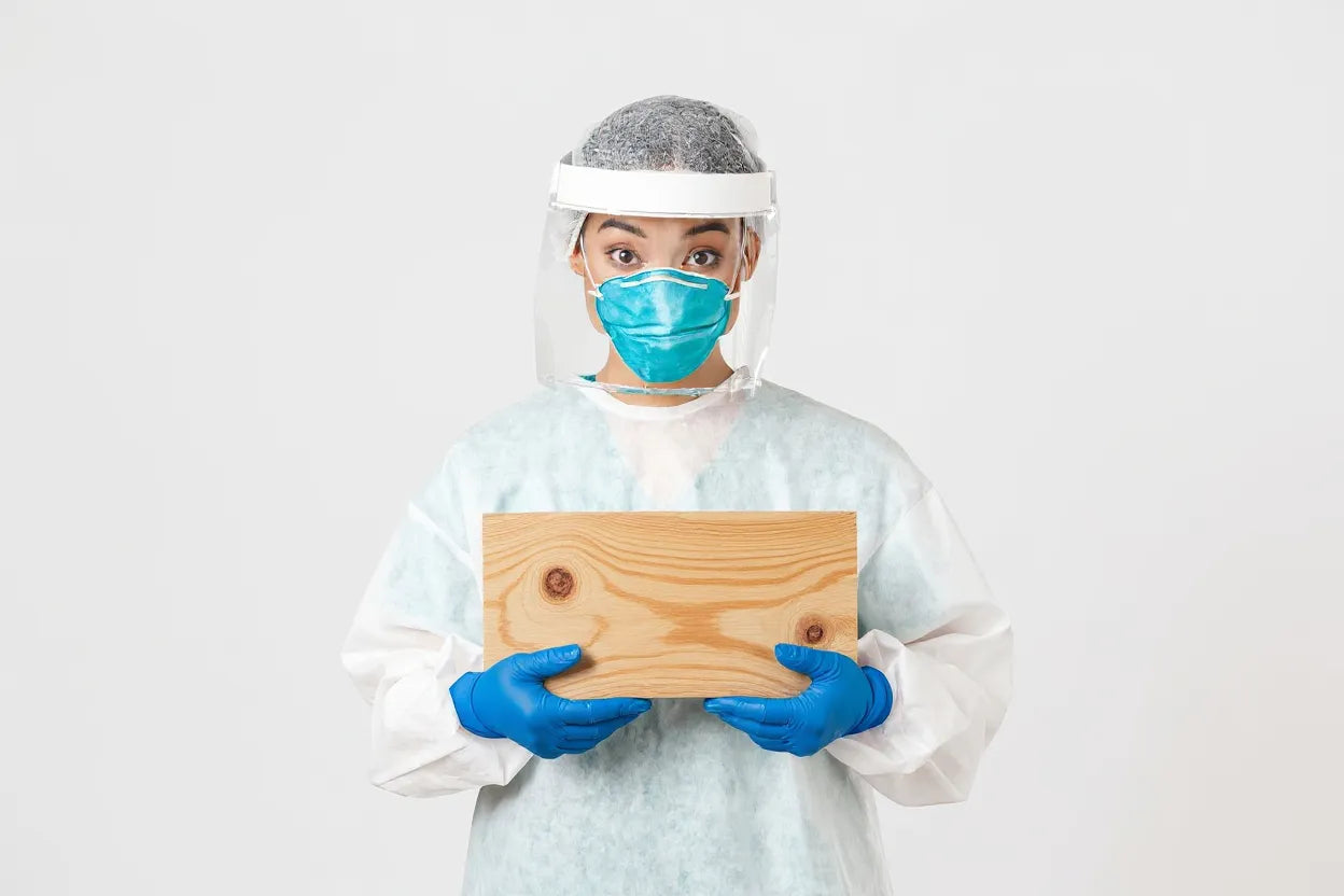 A scientist with a wood sample