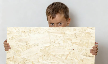 A boy with a OSB board