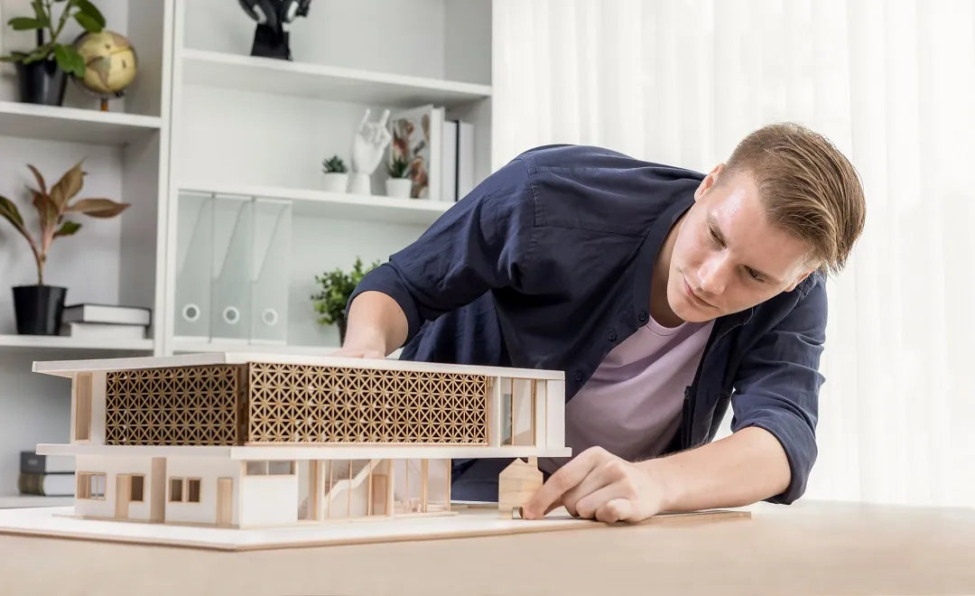 Architect with a architectural model created from 3mm plywood