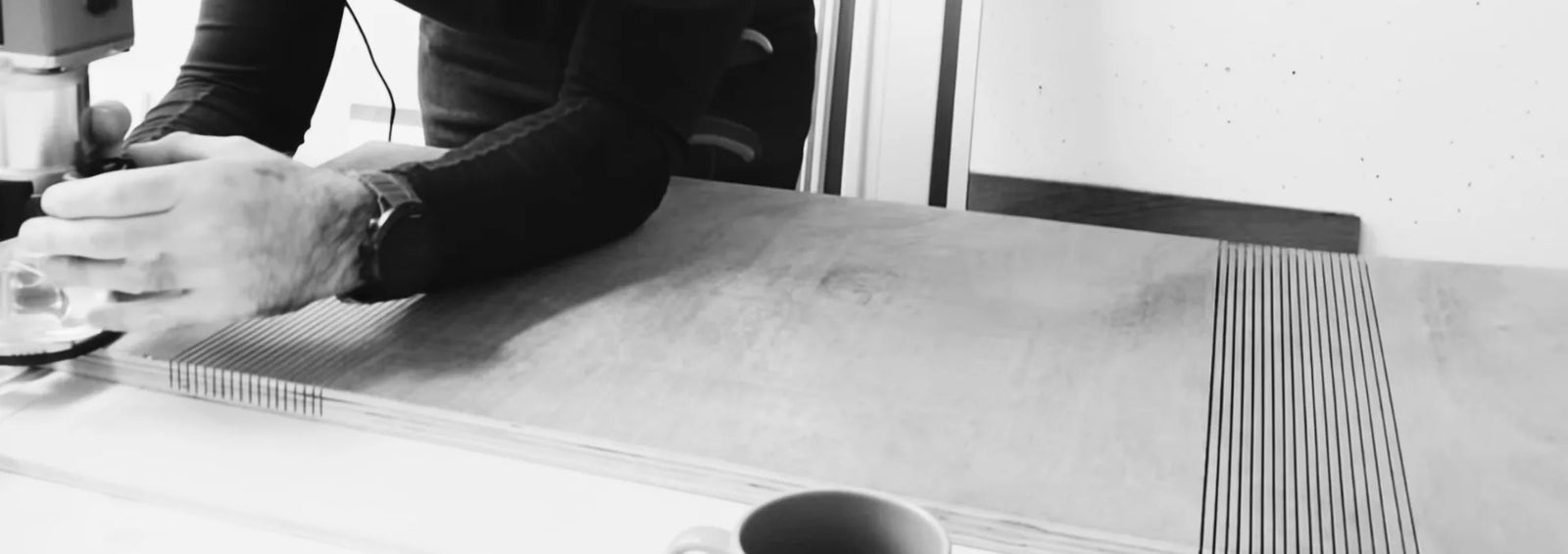 Black and white photo of plywood kerf bending process