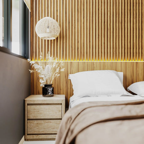 Modern bedroom with timber batten feature wall, wooden bedside table, and decorative lamp.