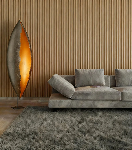 Scalloped Wall Panels in a modern interior with a lamp and grey sofa