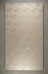 Architectural 3D MDF Wall Panel Basket Weave with a geometric pattern of interlocking hexagons and triangles, featuring a finish in champagne gold and beige tones, mounted on a textured grey wall  - Ply Online