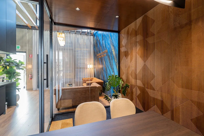 Modern office interior with Mirage panels on the walls and a view of a cityscape through large windows.