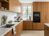 A modern kitchen interior with a marble benchtop and cabinets made with Messmate Timber Veneer Panel A/B UV-Coated FOSB 19x2745x1220 mm - Ply Online.