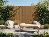 Landscaped garden with a timber batten privacy fence and outdoor bench - Ply Online