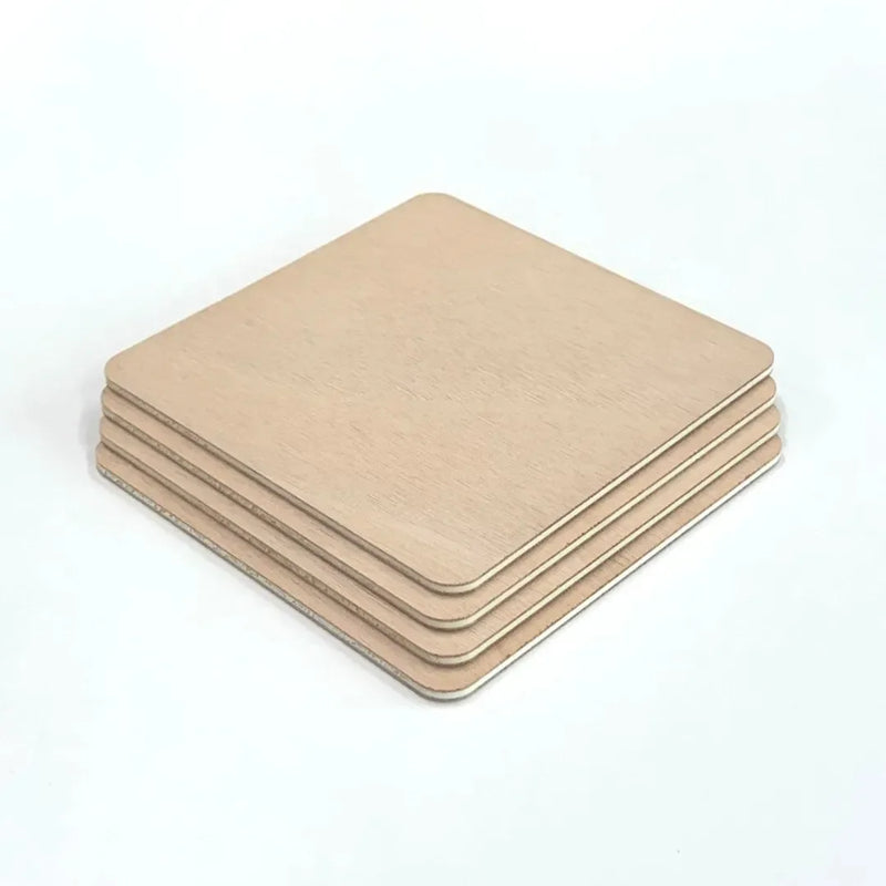 Stack of okoume plywood samples with rounded corners on a white background
