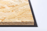 Close-up of OSB3 18mm oriented strand board sheet on white background