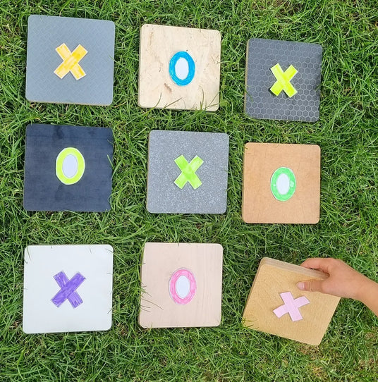 Plywood Tic Tac Toe on the grass